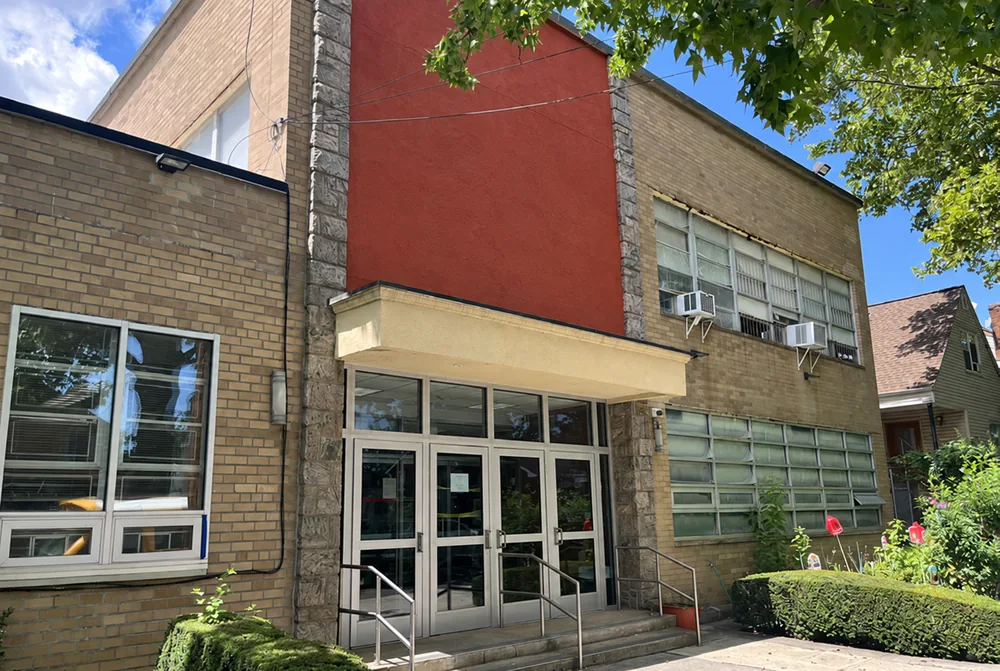 The school building at 71-64 168th Street; signage digitally removed